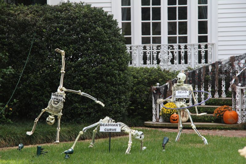 Skeleton gymnasts in yard
