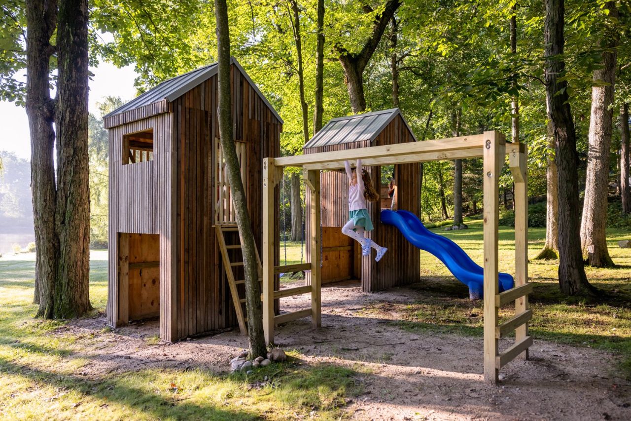 Upcycled Twin Treehouses-slide and monkey bar